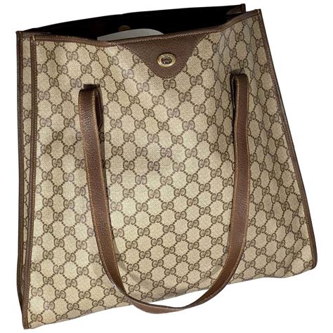 large gucci vintage tote with front pockets|Gucci bag old collection.